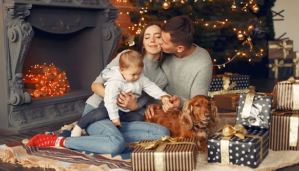 family-with-cute-dog-home-near-christmas.jpg